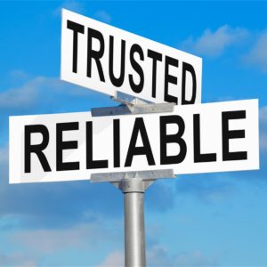Road sign that has the words "trusted" and "reliable"